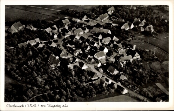 Postcard Obersteinach Ilshofen in Württemberg, aerial view, many roofs, rural surroundings, trees