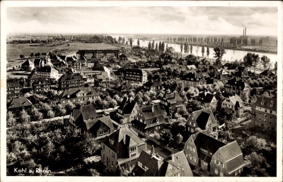 Postcard Kehl am Rhein, aerial view of many houses, river in the background