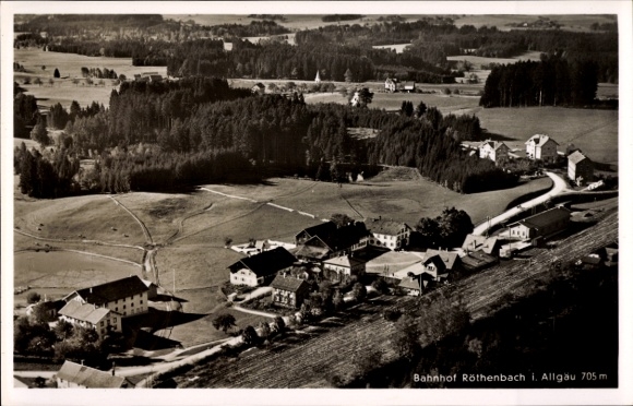 Postcard Röthenbach im Allgäu, aerial photograph, train station
