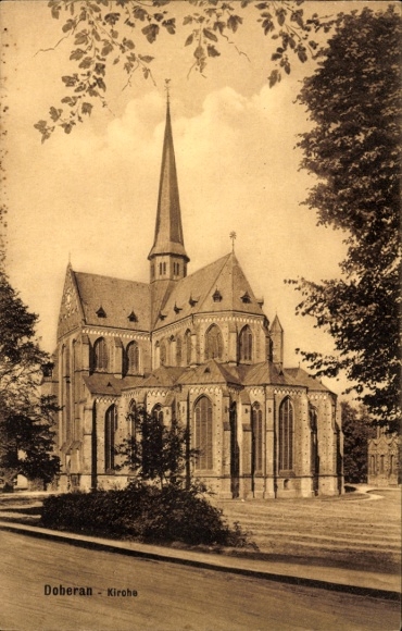 Postcard Bad Doberan in Mecklenburg, Doberan Church, Gothic architecture, high spires, trees in the foreground