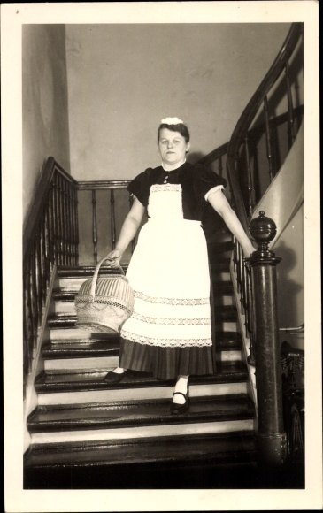 Photo Postcard Lübeck in Schleswig Holstein, maid in service uniform, stairs