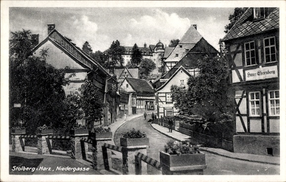 Postcard Stolberg in the Harz, Niedergasse, old half-timbered houses