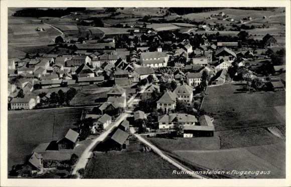 Postcard Ruhmannsfelden in the Bavarian Forest, aerial view of rural surroundings, many roofs