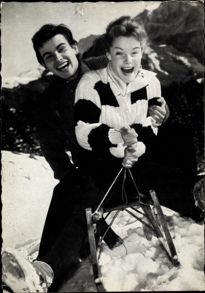 Postcard actress Romy Schneider, actor Horst Buchholz, sledge