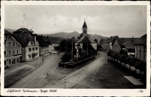 Ak Bodenmais im Bayerischen Wald Niederbayern, Teilansicht der Stadt, Kirche, Geschäfte, Denkmal
