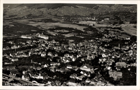 Postcard Bühl in Baden Black Forest, aerial view of many houses, mountains in the background, black and white