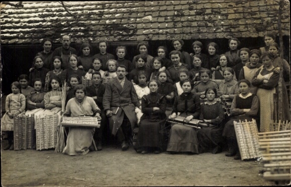 Photo Postcard Group photo of women with two men, basket weavers