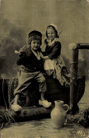 Postcard child portrait, tobacco pipe, traditional costume