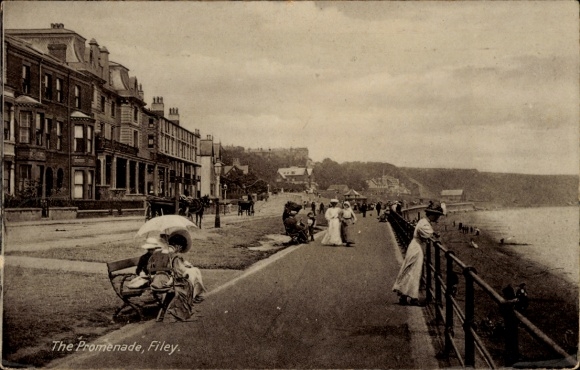 Postcard Filey Yorkshire England, built-up coastal area, promenade, walkers, lovely weather.