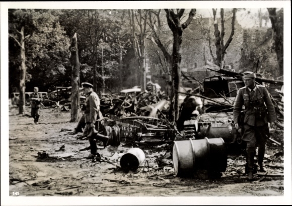 Photo Shot up war equipment in front of the citadel of Boulogne, Wehrmacht soldiers. June 1940