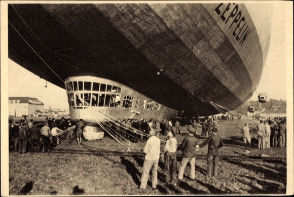 Postcard airship LZ 127 Graf Zeppelin, after landing, holding crew on ropes and ropes