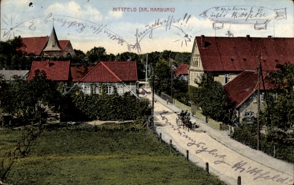 Ak Hittfeld Seevetal in Niedersachsen, Teilansicht, Straße, Kirche