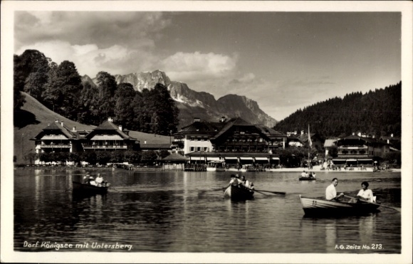 Postcard village of Königsee Königssee Upper Bavaria, partial view with Untersberg, rowing boats