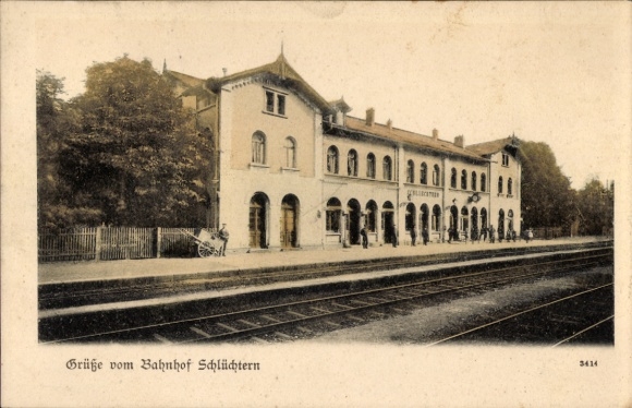 Postcard Schlüchtern in Hesse, train station greeting card, train station, people, architecture