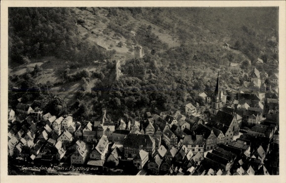 Postcard Gemünden am Main Lower Franconia, aerial view of Gemünden, view of houses, castle in the background