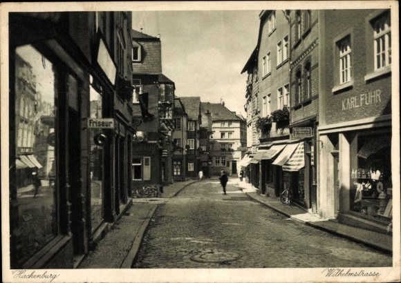 Postcard Hachenburg in the Westerwald, Wilhelmstraße, hairdresser, shop of Karl Fuhr