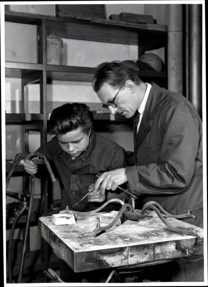 Photo Berlin, Bert Sass, master locksmith and apprentice at work