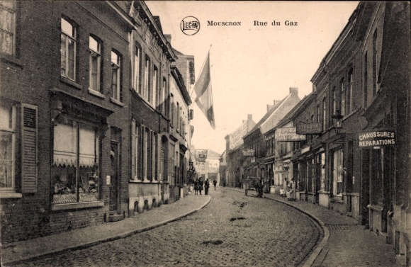 Postcard Mouscron Wallonia Hainaut, street with houses, flag, signs, people