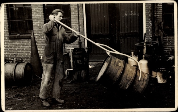 Photo Postcard Man in work clothes, barrel, holding device, lever bar, gas bottles