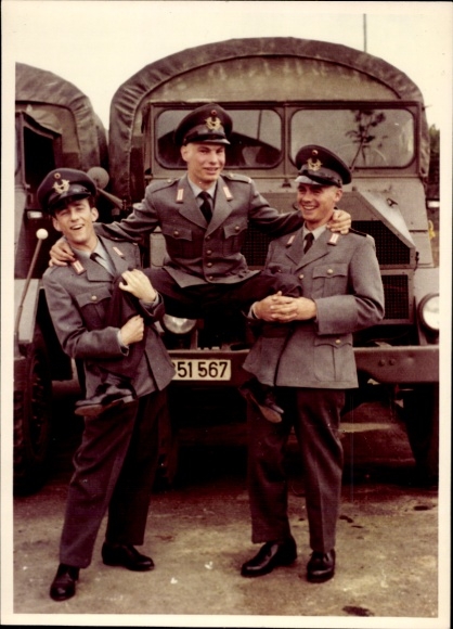 Photo GDR era, policemen in uniforms, truck in the background