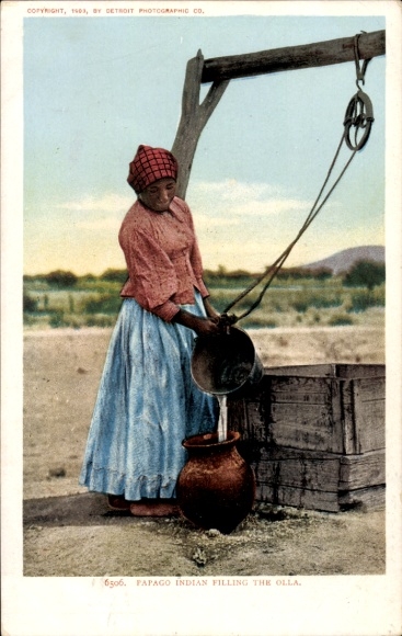 Postcard North America, woman fetching water from the well