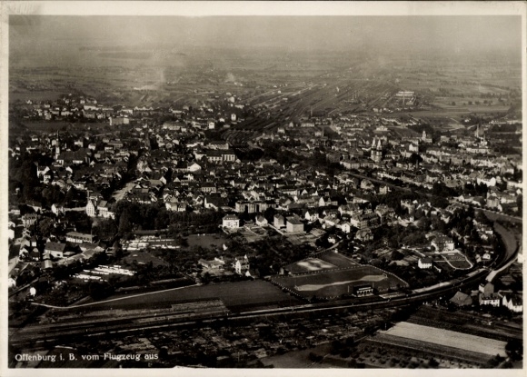 Postcard Offenburg in Baden Black Forest, aerial view of many houses, landscape, railway tracks, clouds