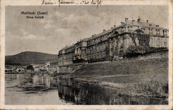 Mettlach in Saarland, old castle, river landscape, buildings along the river, mountains in the background...