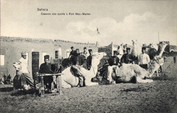 Postcard soldiers in uniform with camels in front of the Spahis barracks in Fort Mac-Mahon