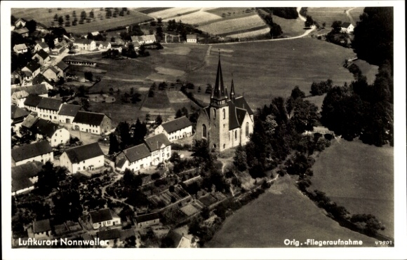 Ak Nonnweiler in Saarland, stadsgezicht, kerk, luchtfoto