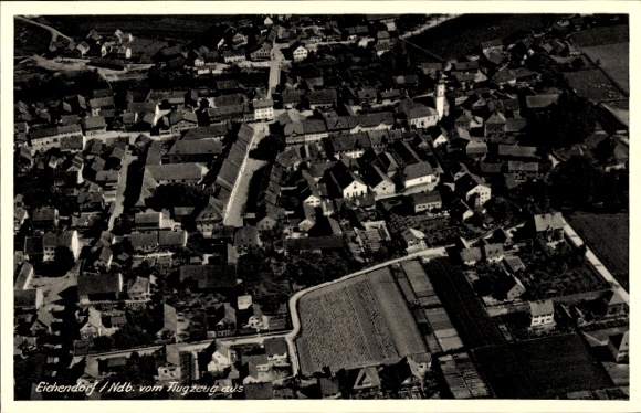 Postcard Eichendorf in Lower Bavaria, aerial view of many roofs and streets visible