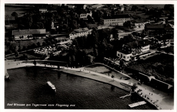 Postcard Bad Wiessee in Upper Bavaria, aerial view, Tegernsee, many buildings, lake route, boats, people