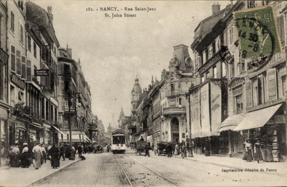 Ak Nancy Meurthe et Moselle, Straße mit Straßenbahn, Geschäfte, Menschen,  