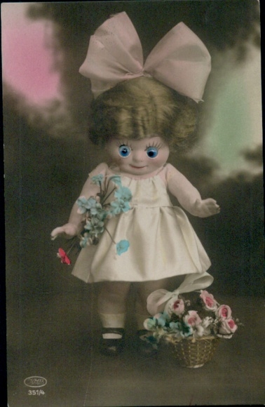 Mechanical Postcard doll with glass eyes, dress, bow, flower basket