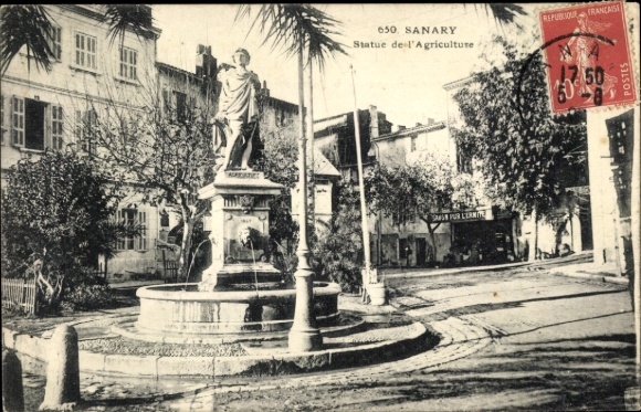 Postcard Sanary sur Mer Var, fountain with statue, text in French, trees and buildings in the background