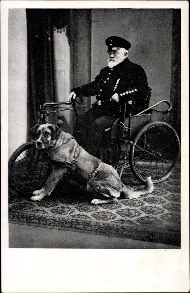 Postcard war veteran in a wheelchair, disability dog