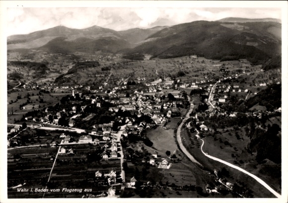 Postcard Wehr in the Black Forest Baden, aerial view of a town, mountains in the background, river, residential buildings