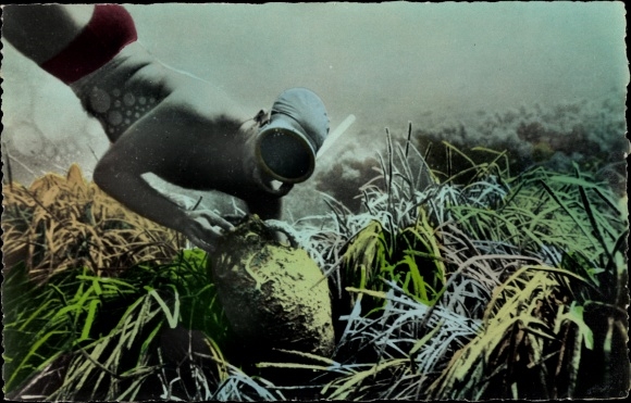 Postcard diver raises an amphora, snorkel