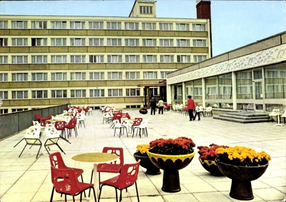Postcard Börgerende Rethwisch on the Baltic Sea, terrace with red chairs, tables, and flowerbeds, i...
