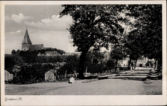 Postcard Gnoien in Mecklenburg, street section, church