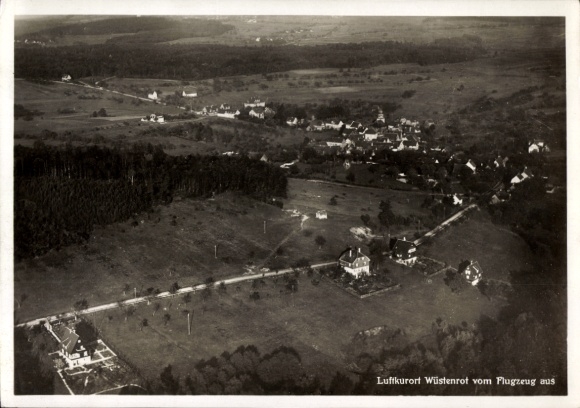 Postcard Wüstenrot in Württemberg, aerial view from the airplane, quiet landscape, houses, forest