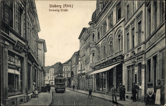 Postcard Stolberg in the Rhineland, Steinwegstrasse, tram, shop A. Schulte