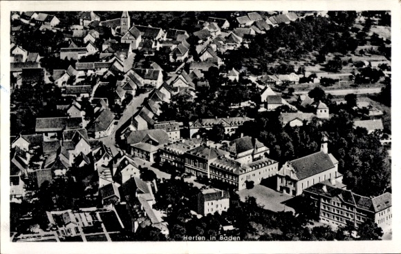 Ak Herten Rheinfelden in Baden, Luftaufnahme von  viele Dächer, Straßen, Kirche sichtbar