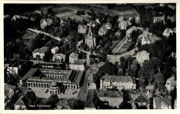 Postcard Bad Pyrmont, aerial view of the town, church, Hylliger Born