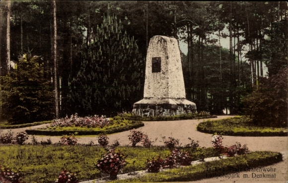 Ak Grafenwöhr in der Oberpfalz Bayern, Denkmal im Volkspark, Blumenbeete, Bäume, Monument