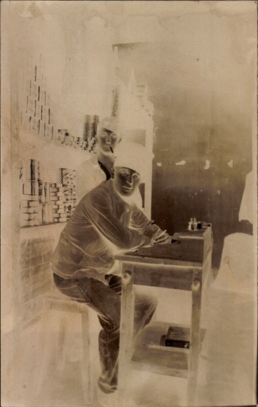 Photo Postcard man at desk writing, letter, cigarettes, negative photo