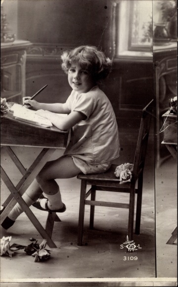 Postcard boy at the desk, misprint