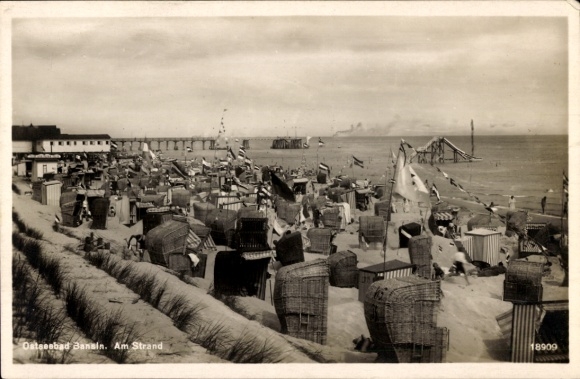 Postcard Ostseebad Bansin on Usedom, beach shot with beach chairs, pier in the background, maritime