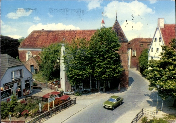 Postcard Greetsiel Krummhörn in East Frisia, view of a town, church, trees, cars, old buildings