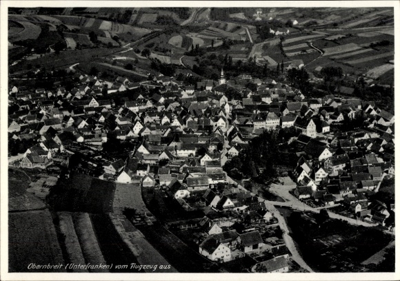Postcard Obernbreit in Lower Franconia, aerial photograph, many houses, rural surroundings, from airplane