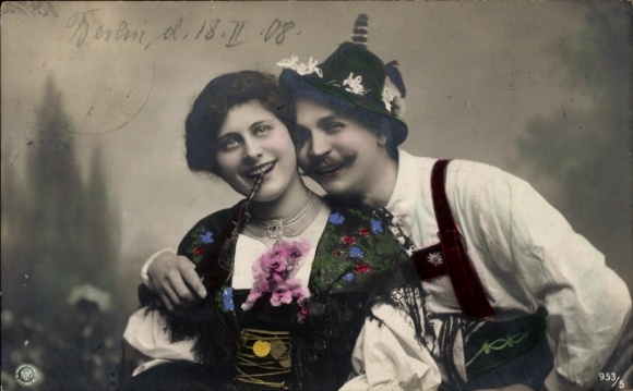 Postcard Lovers in folk costumes, woman with pipe